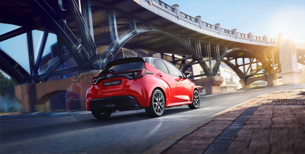 Toyota Corolla Hatchback driving down the road