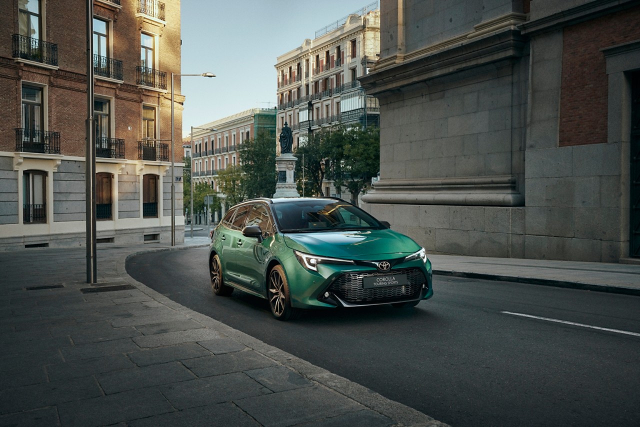 Toyota Corolla Hatchback driving down the road